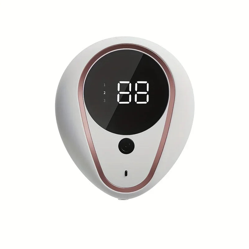 Appareil électronique blanc et or rose distribuant du savon 