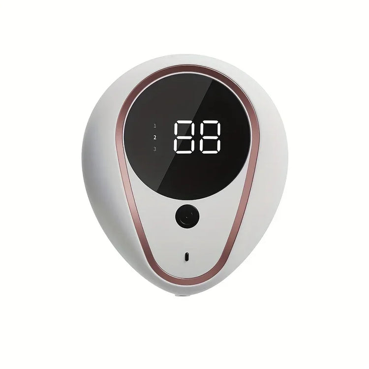 Appareil électronique blanc et or rose distribuant du savon 