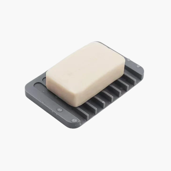 Porte-savon gris en utilisation avec savon - Support savon antidérapant élégant pour salle de bain