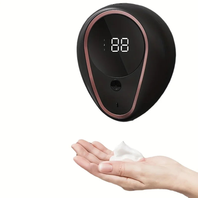 Appareil électronique noir et or rose distribuant du savon 
